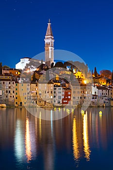 Sunset at medieval town of Rovinj, colorful with houses and church