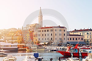 Sunset at medieval town of Rovinj, colorful with houses and church,harbor