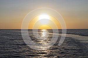 Sunset on the mediterranean sea in summer near the harbor of island of Procida