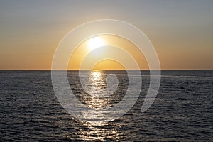 Sunset on the mediterranean sea in summer near the harbor of island of Procida