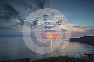 Sunset at milazzo in sicily photo