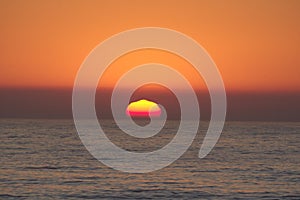 Sunset mirage over the water