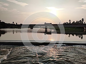 sunset at the moment bridge waters