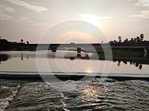 sunset at the moment bridge waters