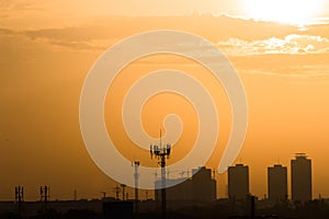 Sunset mood building city and Telephone communication tower