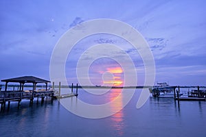 Sunset and moonrise over Masonboro Inlet Wrightsville Beach NC