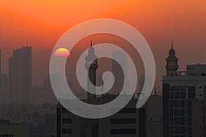 Sunset with Mosque Minarets in Silhouette