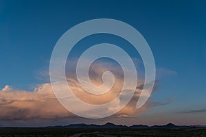 sunset mountain landscape in mongolia, pink unusual cloud