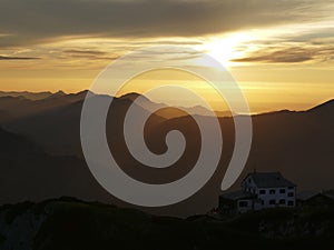 Sunset mountain panorama with accommodation Stoerhaus at Untersberg mountain, Bavaria