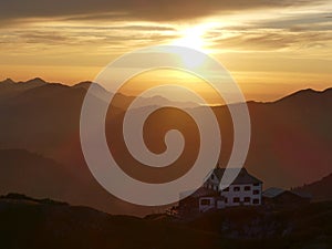 Sunset mountain panorama with accommodation Stoerhaus at Untersberg mountain, Bavaria