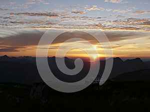 Sunset mountain panorama with accommodation Stoerhaus at Untersberg mountain, Bavaria