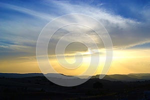 Sunset with mountains on the horizon