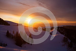 Sunset in the mountains with shelter in the foreground