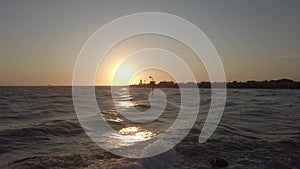 Sunset at the mouth of the Tiber river at Fiumicino with rough sea