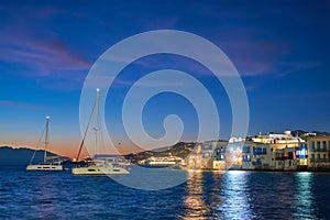 Sunset in Mykonos, Greece, with cruise ship and yachts in the harbor