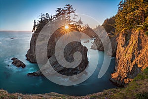 Sunset at Natural Bridges along Samuel H. Boardman State Scenic Corridor, Oregon during a golden hour sunset, USA.