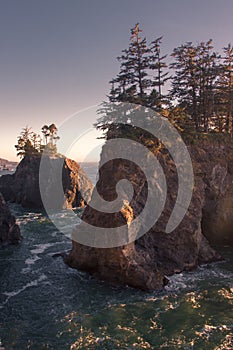 Sunset on natural bridges along the west coast of the Pacific Ocean, Oregon