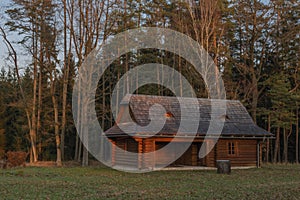 Sunset near Trhove Sviny town in south Bohemia with wooden cottage