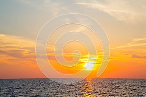 Sunset on the ocean with horizon for an atmospheric background.