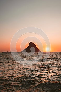 Sunset ocean and island Bleiksoya rock landscape in Norway summer travel vacations nature scenery