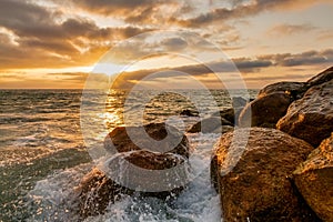 Sunset Ocean Wave Breaking Rocks