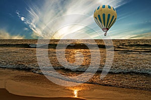 Sunset ocean waves, tropical beach with flying hot air balloon