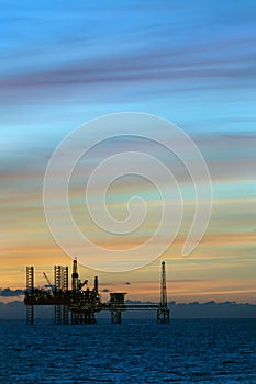 Sunset and Oil platform