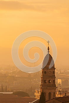 Sunset with old bell tower