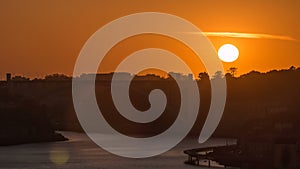 Sunset in Old city Porto at river Duoro,with Port transporting boats timelapse, Oporto, Portugal