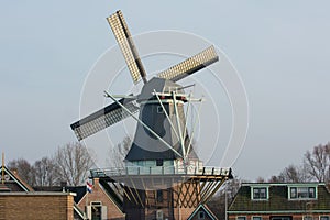 Sunset with old Dutch windmill