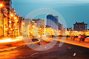 Sunset in Old Havana with the street lights of El Malecon photo