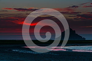 Sunset on one of France\'s most visited sites with Mont Saint Michel in the background