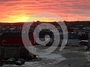 Sunset with orange sky over the city of Kuujjuaq