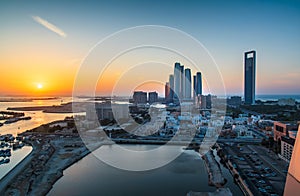 Sunset over Abu Dhabi skyline and the downtown modern buildings view