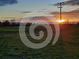 Sunset over an agricultural field, with the Wrekin in the background, Edgmond, Shropshire