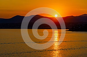 Sunset over Alpes on Azure Coast French Riviera of Mediterranean Sea seen from Saint-Jean-Cap-Ferrat town in France