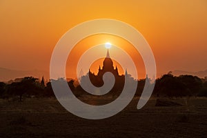 Sunset over ancient temples  pagodas and stupas in Old Bagan  Myanmar Peaceful Asian landscape with Buddhist temple silhouettes.