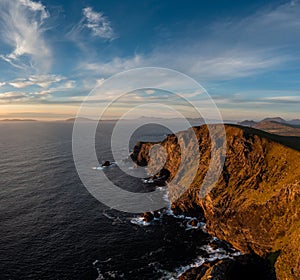 Sunset over the Atlantic Ocean and the cliffs of Bray Head on Valentia Island in County Kerry