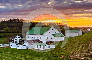Sunset over a barn and farm fields in rural York County, Pennsylvania.