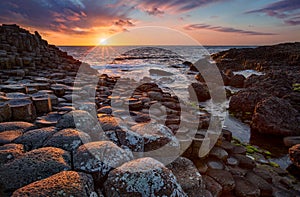 Sunset over basalt columns Giant`s Causeway, County Antrim, Northern Ireland