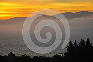 Sunset over the bay on Kaikoura peninsula, South Island, New Zealand