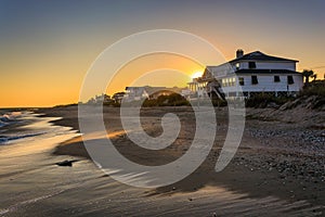 Sunset over beachfront homes at Edisto Beach, South Carolina. photo