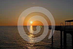 Sunset over Black Sea horizon at pier Batumi Georgia