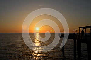 Sunset over Black Sea horizon at pier Batumi Georgia