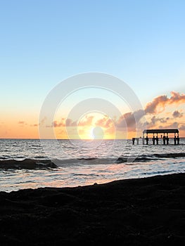 Sunset over blacksand beach near Waimea photo