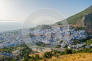 Sunset over the blue Moroccan town of Chefchaouen, as seen from the hill of the Spanish Mosque.