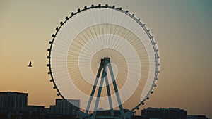 Sunset over Bluewaters island with modern architecture and ferris wheel