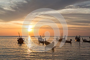 Sunset over boats in Koh Lanta in Thailand