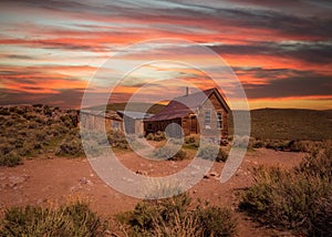 Sunset over Bodie ghost town in California photo