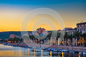 Sunset over Bosa with Temo River and palm trees in Sardinia, Italy
